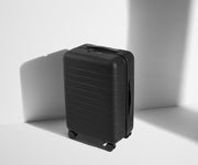Angled product view of The Bigger Carry-On suitcase in Jet Black