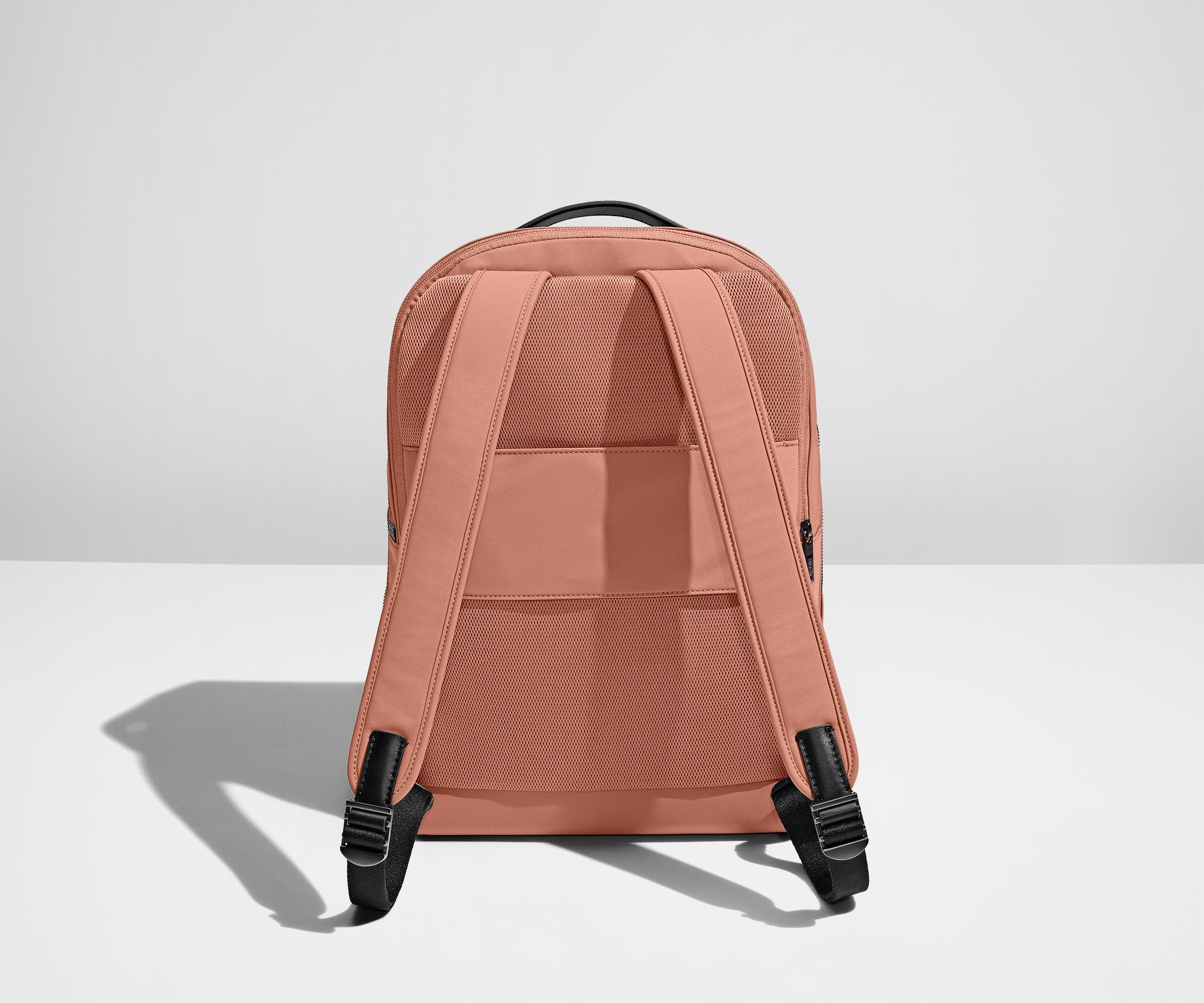Padded shoulder straps and trolley sleeve on the back of a Clay Pink Everywhere Zip Backpack