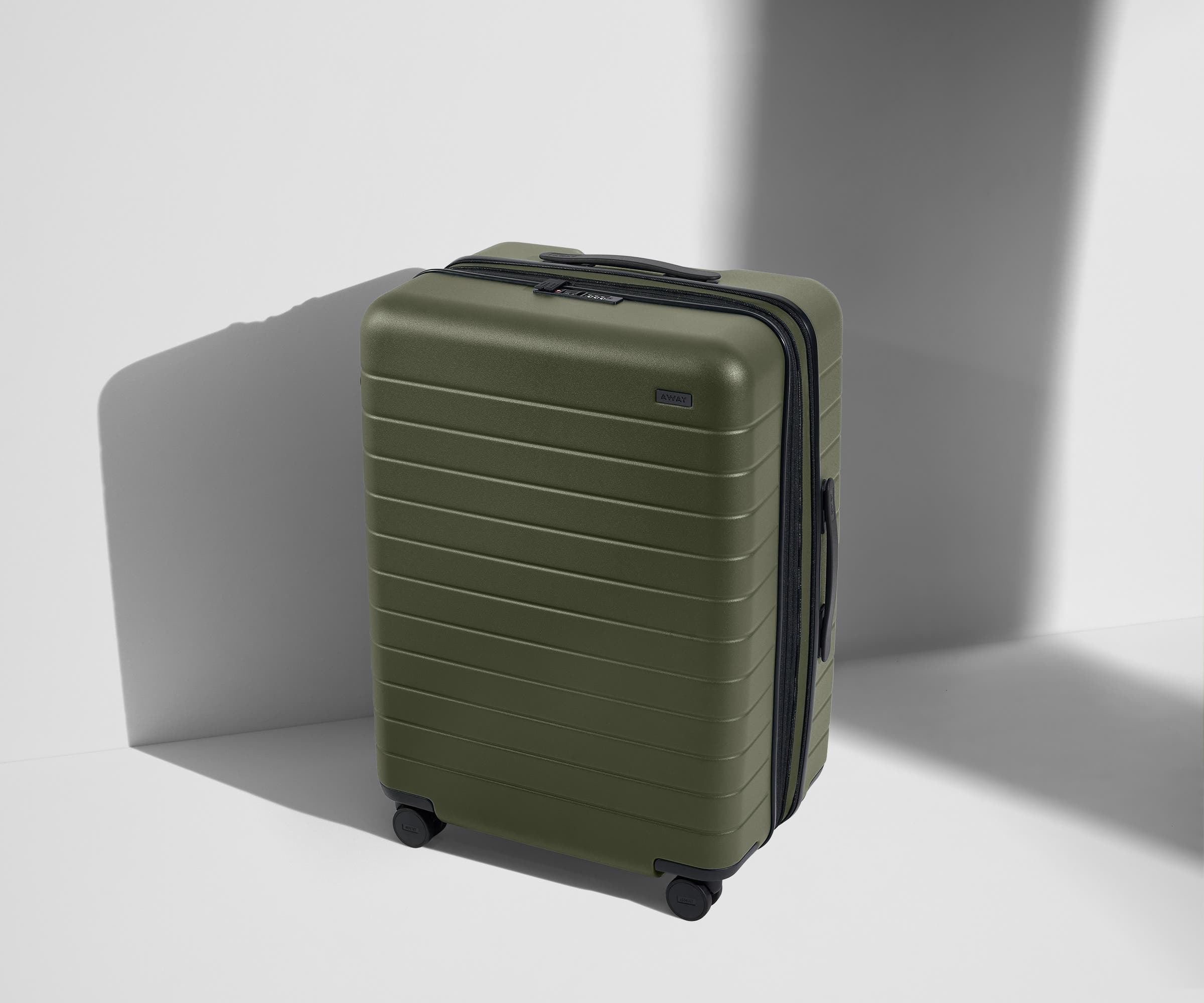 Angled product view of The Medium Flex suitcase in Sea Green