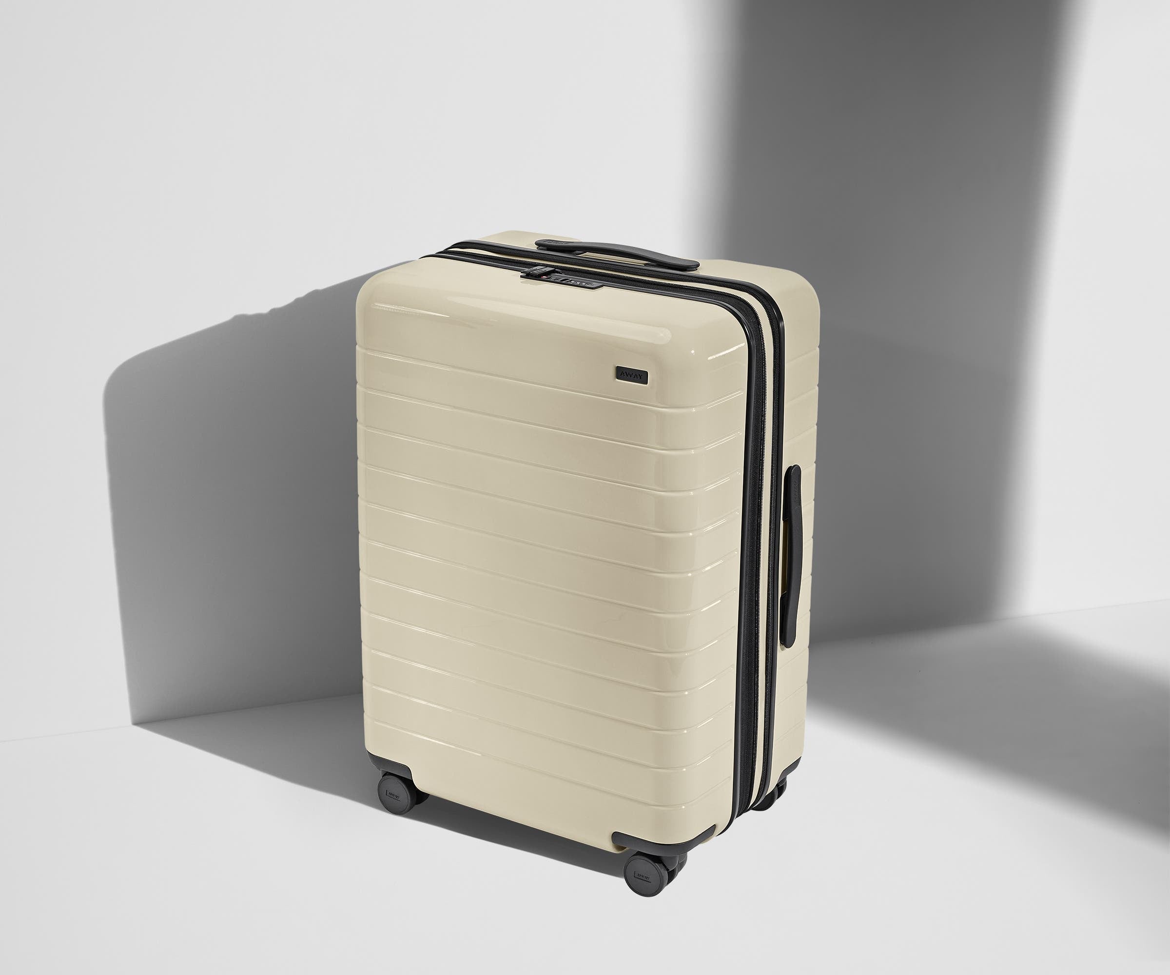 Angled product view of The Medium Flex suitcase in Salt White (Gloss)