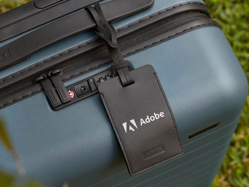 a close crop of a luggage tag with a logo digitally printed on it