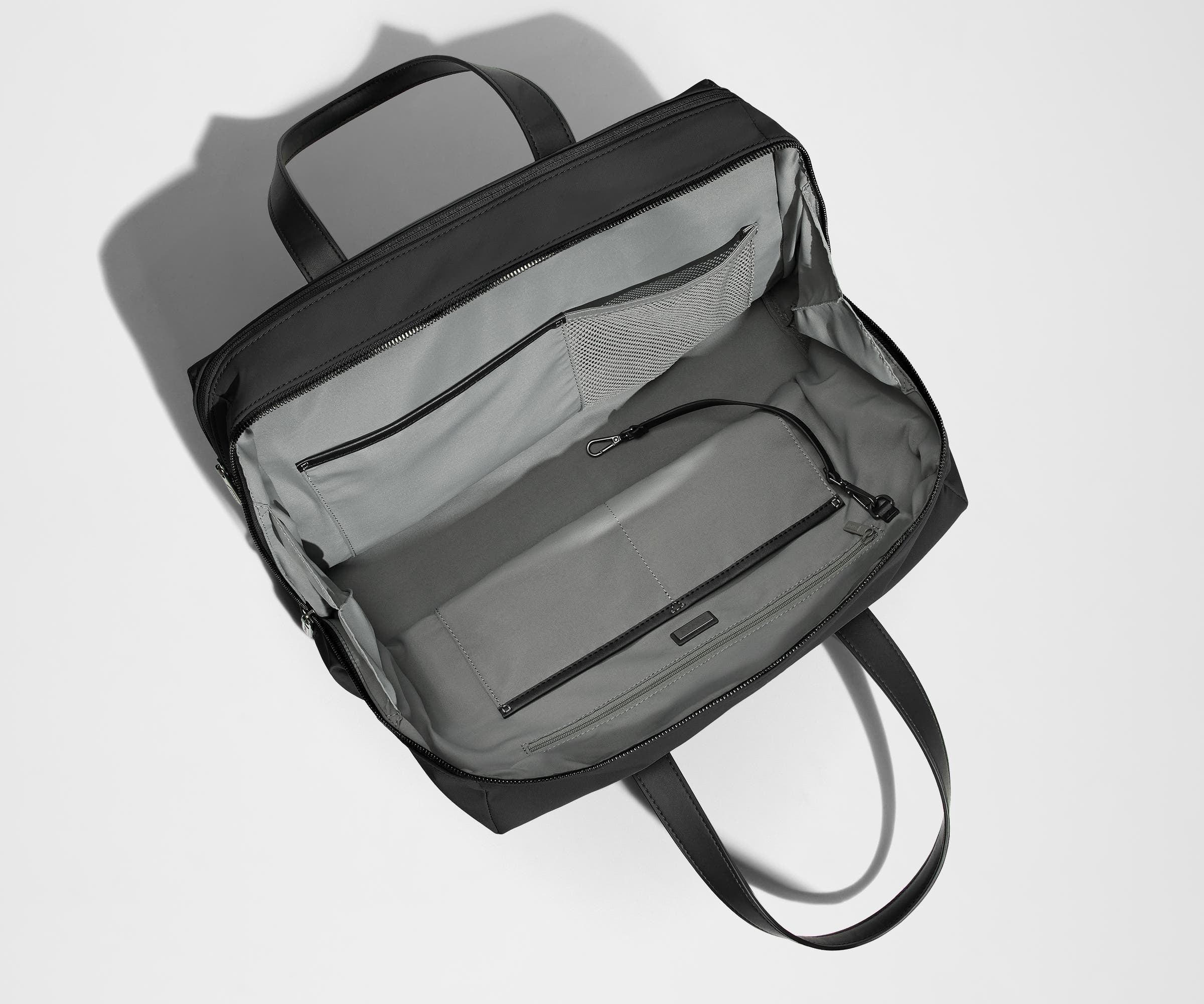 Empty Everywhere Bag, showing the interior organization with multiple slip pockets, zippered pocket, and key leash
