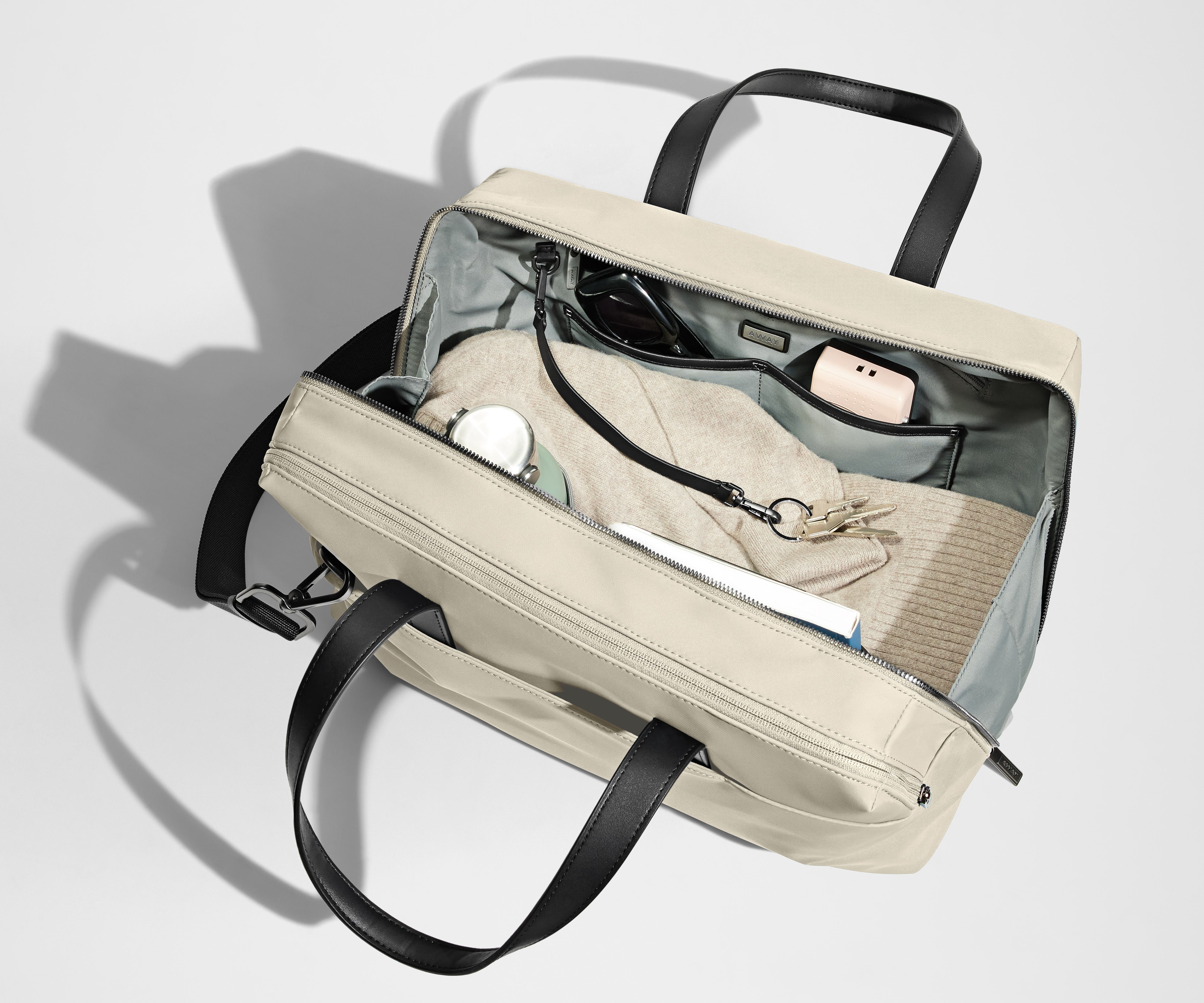 A pair of keys attached to the key leash in the main compartment