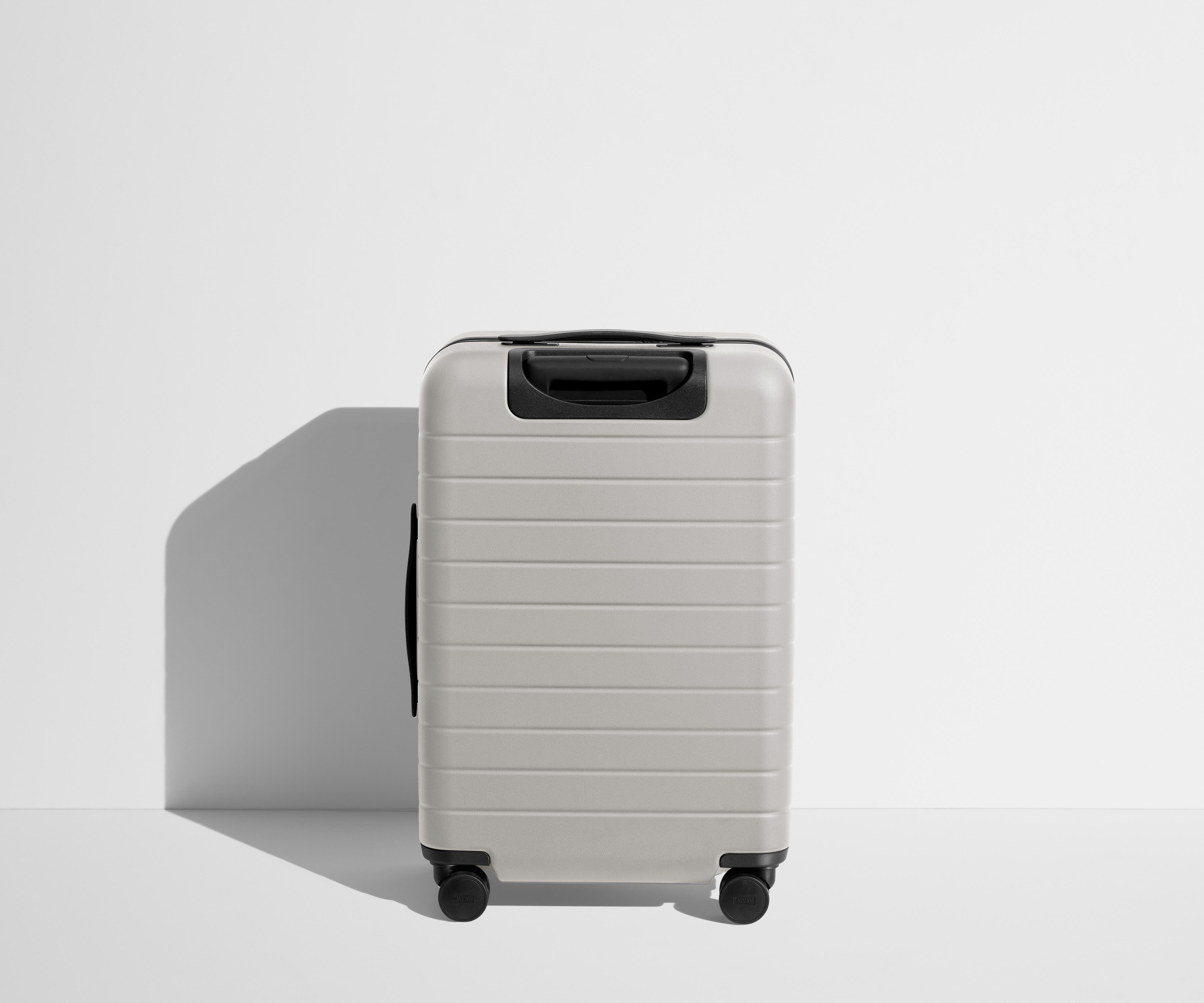 Back product view of The Bigger Carry-On suitcase in Cloud Gray